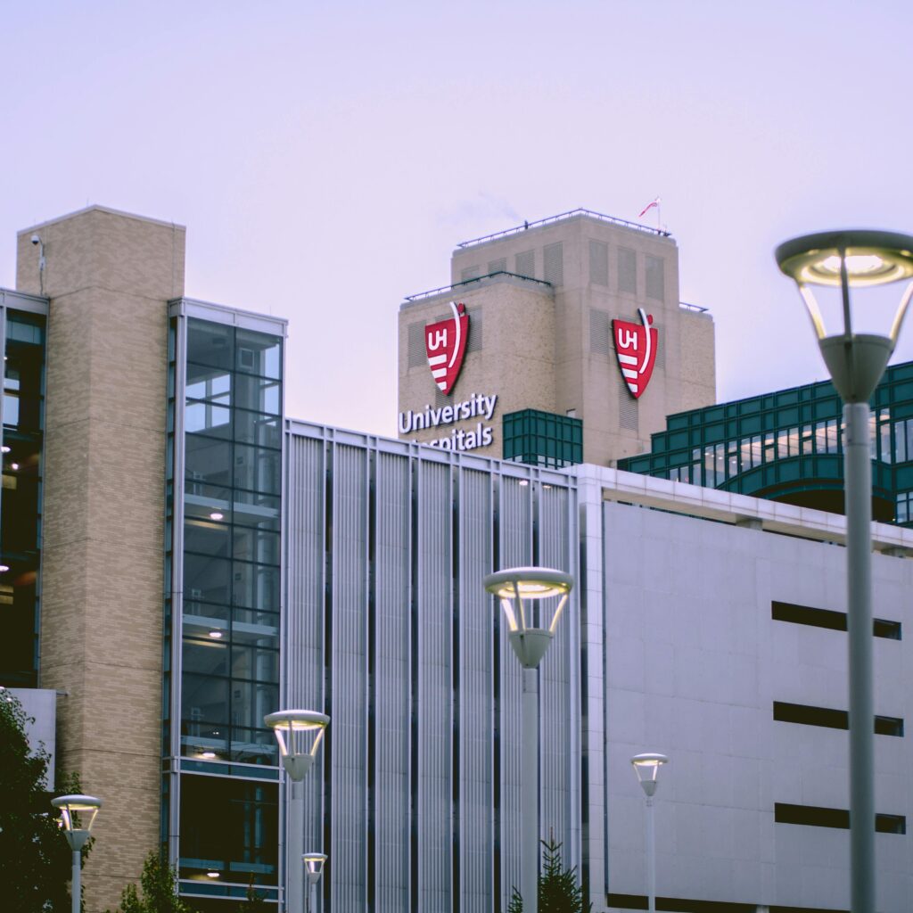 View of University Hospitals building in Cleveland, OH against a clear sky.